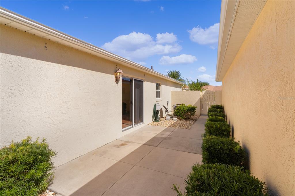 1116 San Bernardo Road The Villages, FL 32162 - Photo 36 of 46 a view of a house with a yard