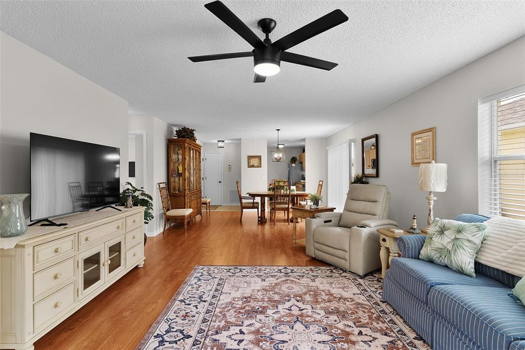 1116 San Bernardo Road The Villages, FL 32162 - Photo 6 of 46 a living room with furniture and a flat screen tv