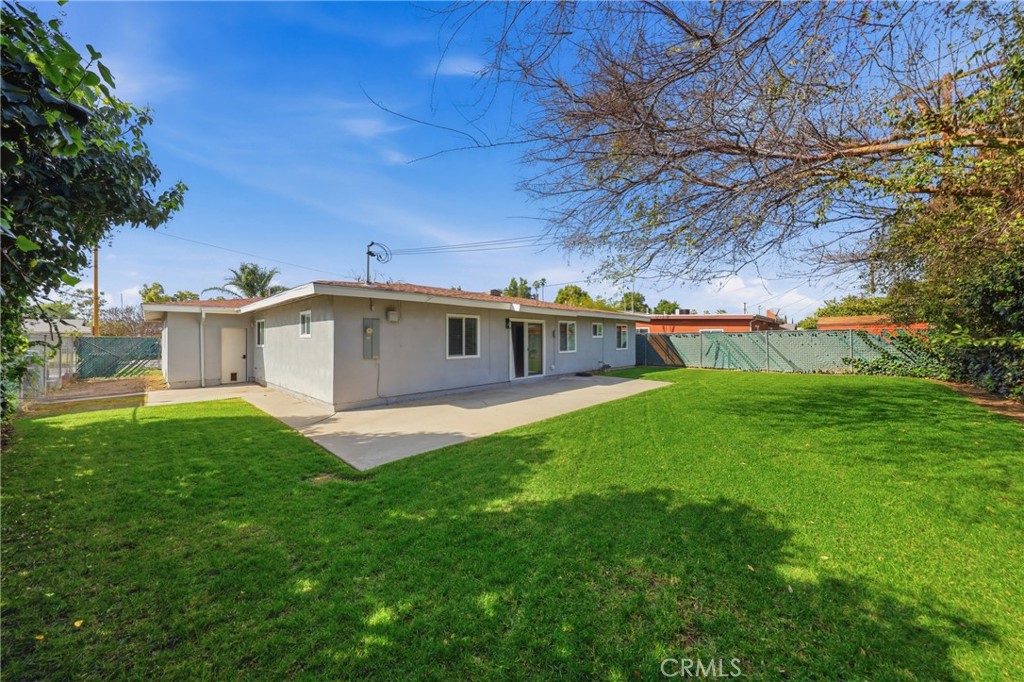 5653 Corwin Lane Riverside, CA 92503 - Photo 14 of 14 a front view of a house with a yard porch and a tree