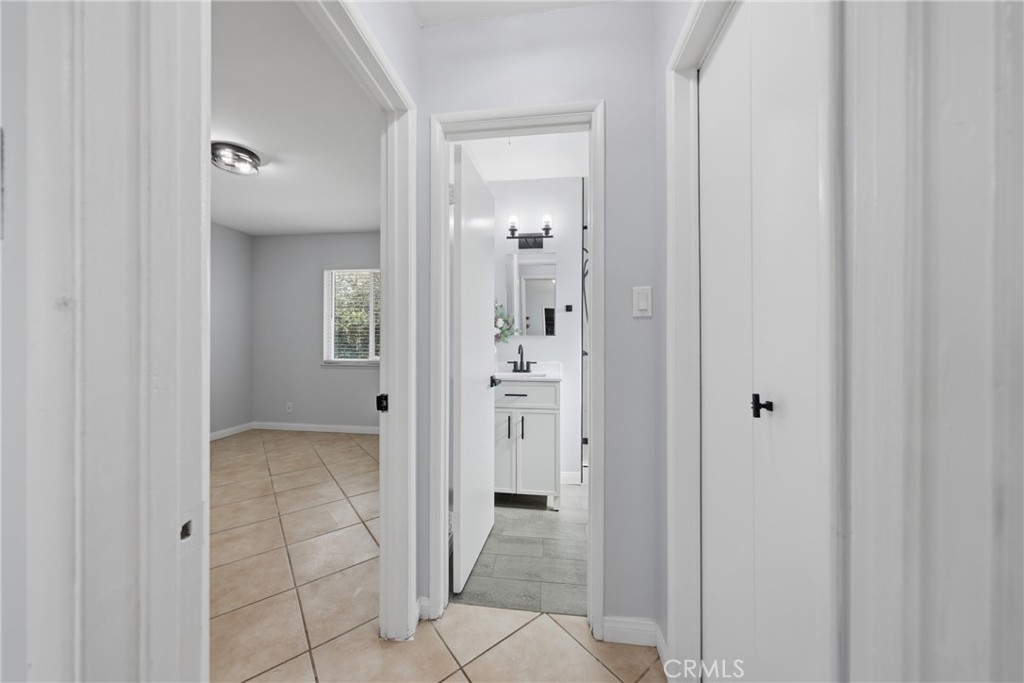5653 Corwin Lane Riverside, CA 92503 - Photo 9 of 14 a view of a hallway with wooden shelves