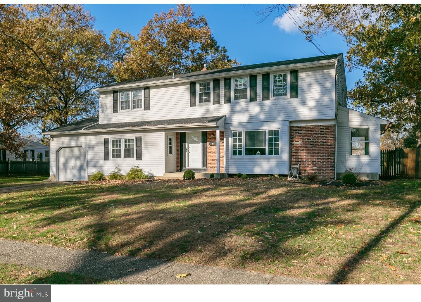 13 Ridgewood Avenue Delran, NJ 08075 - Photo 2 of 25 a front view of a house with a garden