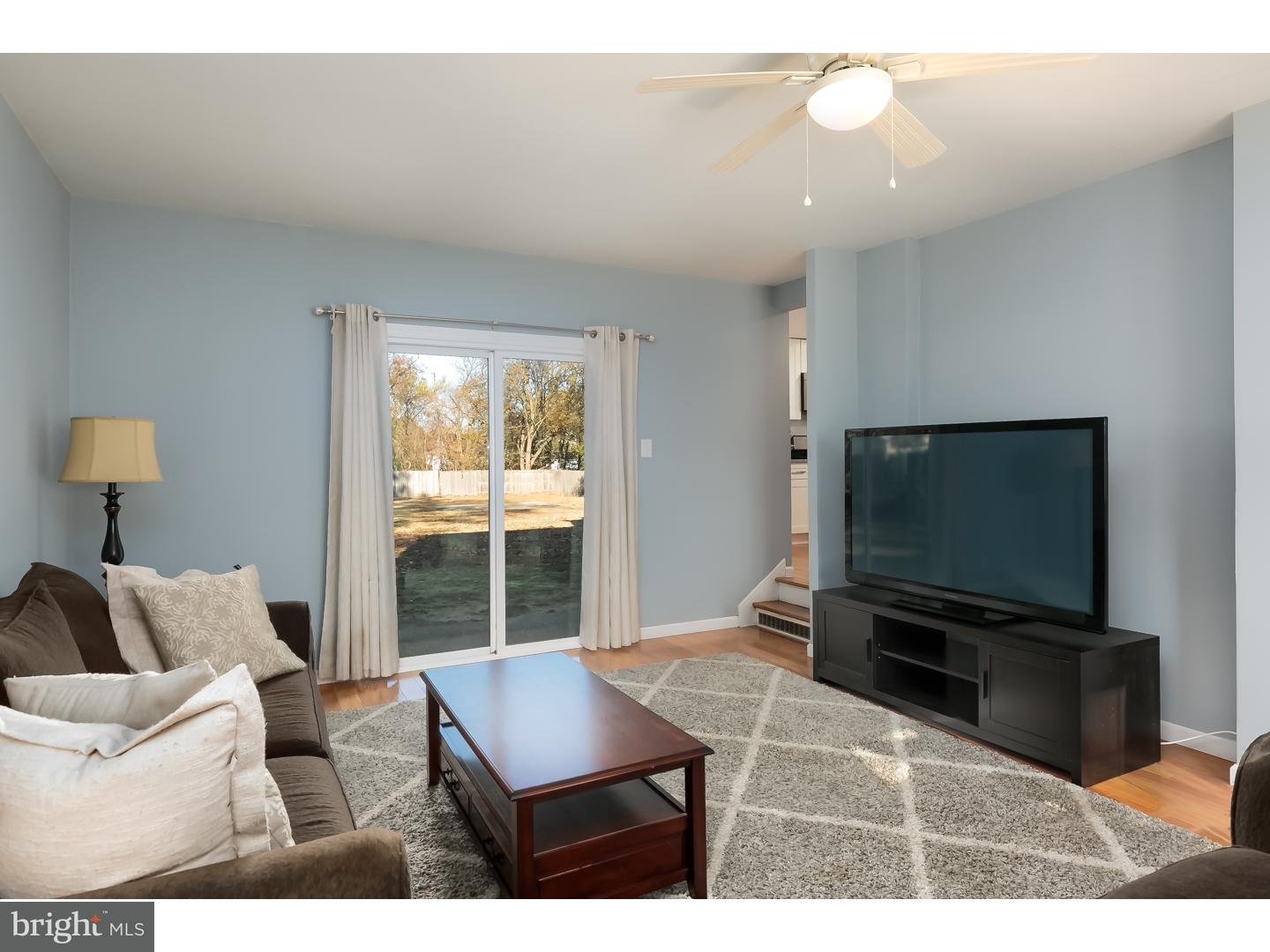 13 Ridgewood Avenue Delran, NJ 08075 - Photo 13 of 25 a living room with furniture and a flat screen tv
