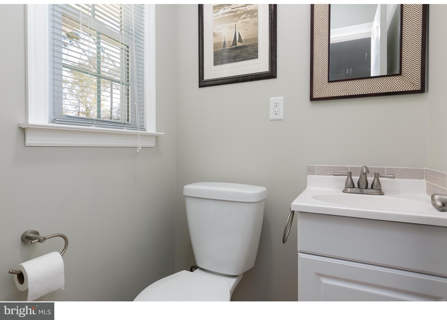13 Ridgewood Avenue Delran, NJ 08075 - Photo 14 of 25 a bathroom with a toilet sink and mirror