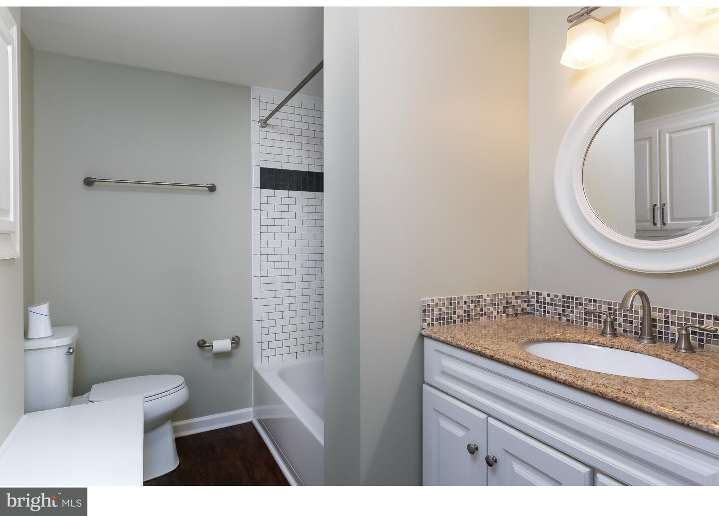 13 Ridgewood Avenue Delran, NJ 08075 - Photo 17 of 25 a bathroom with a granite countertop toilet sink and mirror