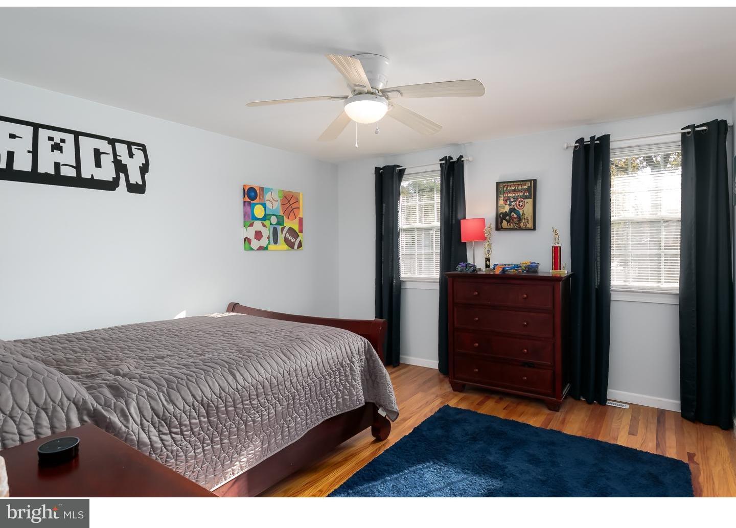 13 Ridgewood Avenue Delran, NJ 08075 - Photo 18 of 25 a bedroom with a bed and a dresser