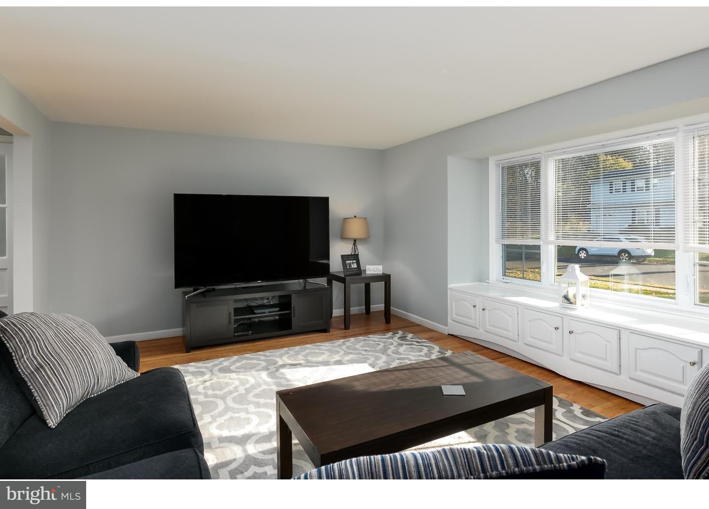 13 Ridgewood Avenue Delran, NJ 08075 - Photo 5 of 25 a living room with furniture and a flat screen tv