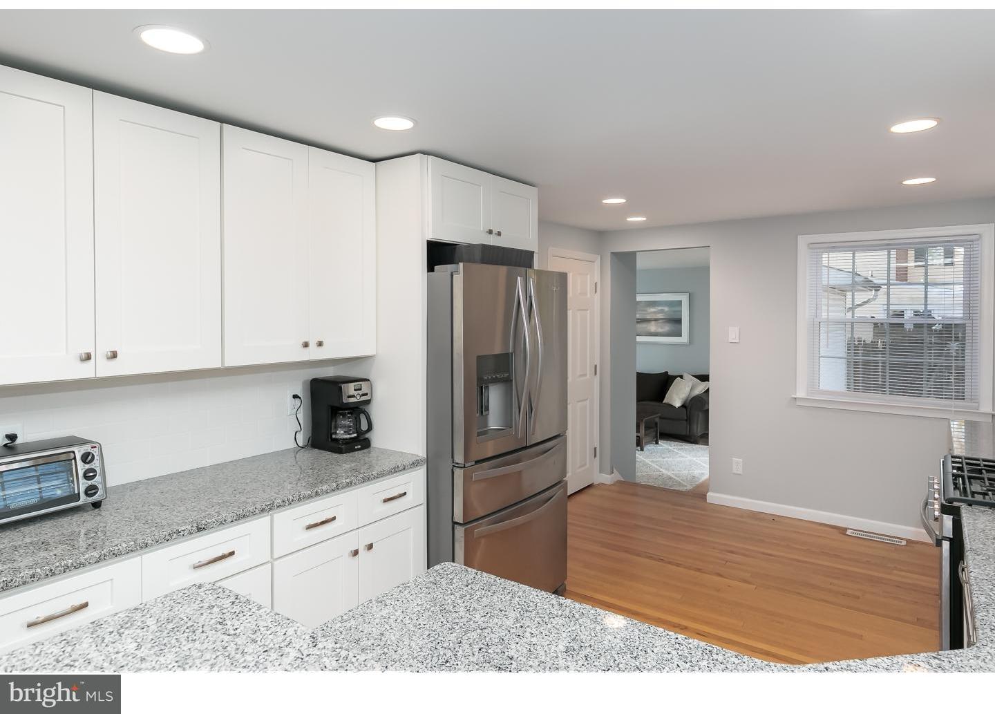 13 Ridgewood Avenue Delran, NJ 08075 - Photo 10 of 25 a kitchen with granite countertop a refrigerator and a sink