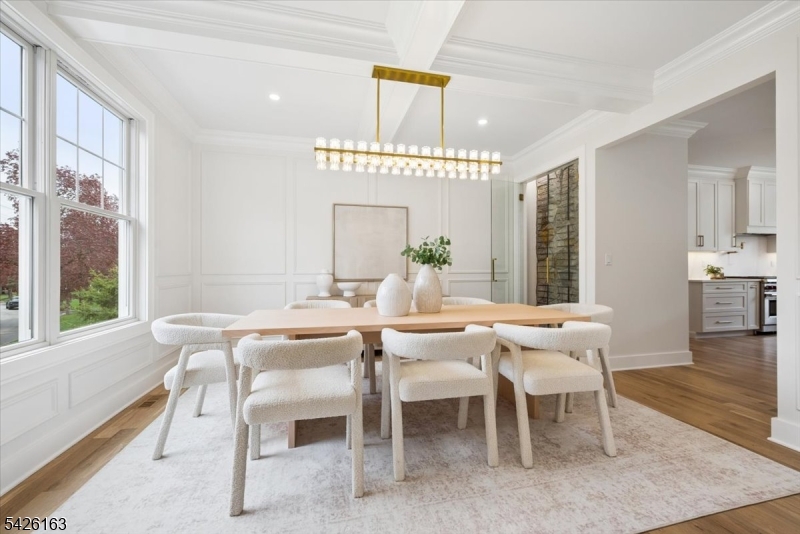 34 Crestview Avenue Madison, NJ 07940 - Photo 12 of 43 a dining room with furniture a chandelier and wooden floor