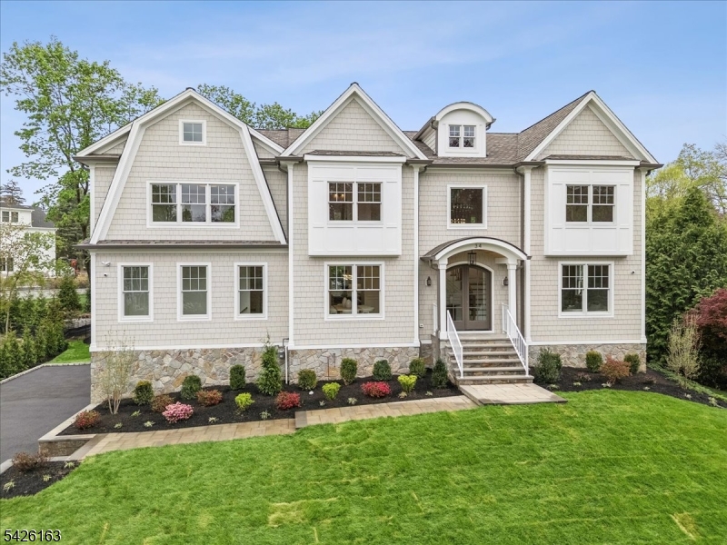 34 Crestview Avenue Madison, NJ 07940 - Photo 2 of 43 a front view of a house with a garden