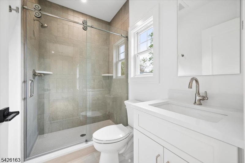 34 Crestview Avenue Madison, NJ 07940 - Photo 32 of 43 a bathroom with a sink toilet and shower
