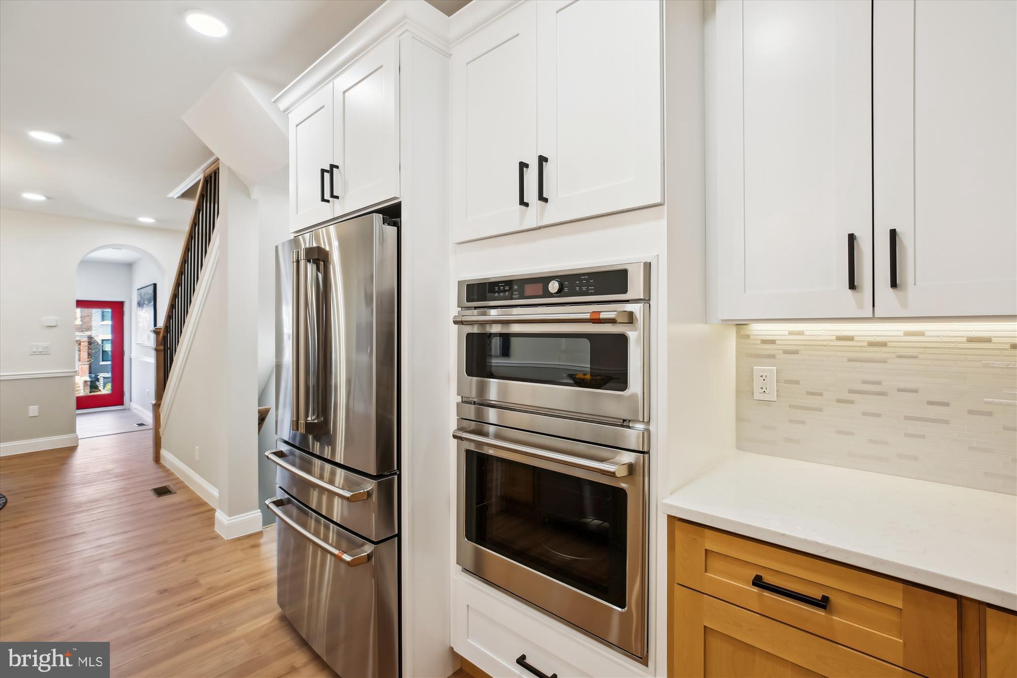 329 15th Street Northeast Washington, DC 20002 - Photo 14 of 71 a kitchen with granite countertop a refrigerator and a stove top oven
