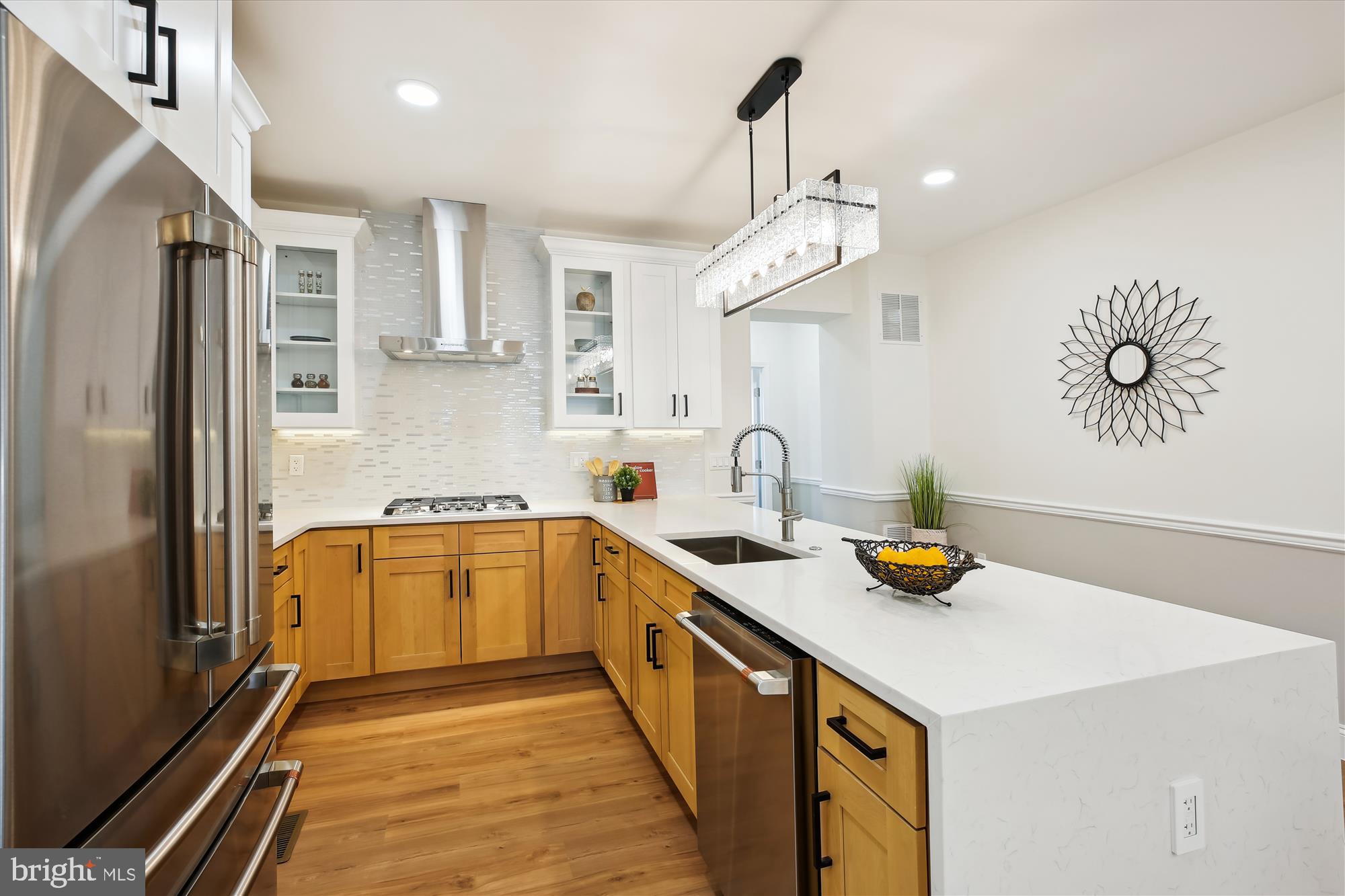 329 15th Street Northeast Washington, DC 20002 - Photo 16 of 71 a kitchen with a sink a counter and stainless steel appliances