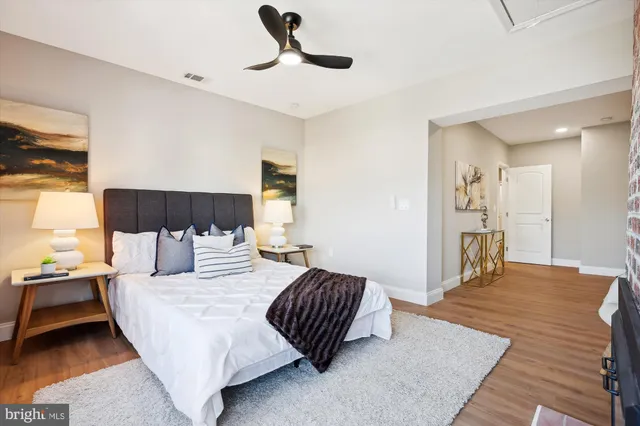 a view of hallway with wooden floor
