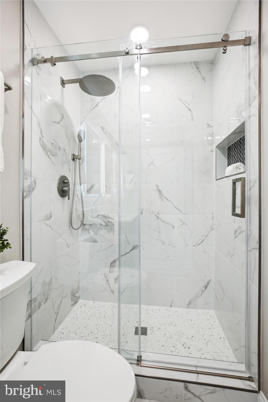 329 15th Street Northeast Washington, DC 20002 - Photo 30 of 71 a bathroom with a shower and a toilet