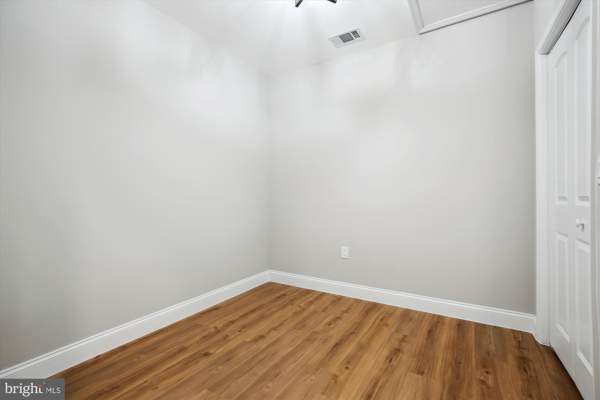 329 15th Street Northeast Washington, DC 20002 - Photo 40 of 71 a view of an empty room with wooden floor