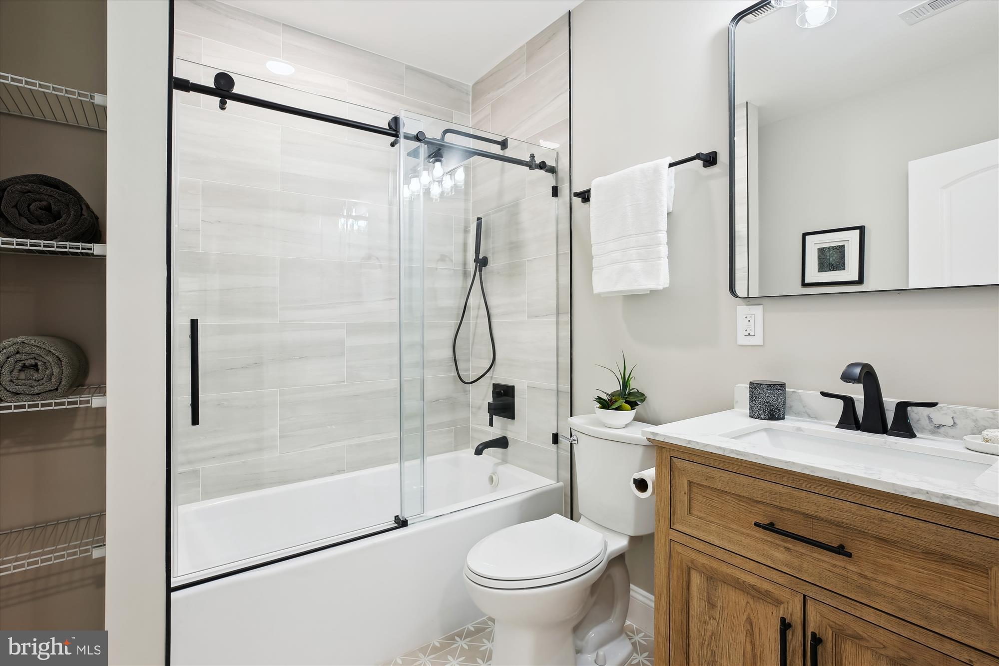 329 15th Street Northeast Washington, DC 20002 - Photo 42 of 71 a bathroom with a granite countertop sink toilet and shower