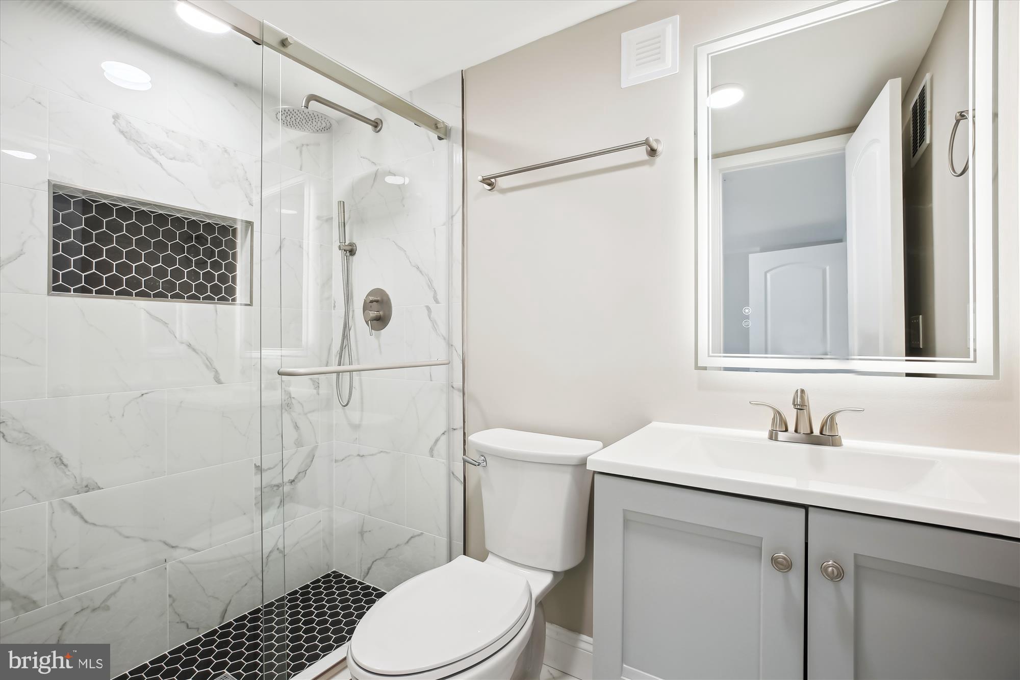 329 15th Street Northeast Washington, DC 20002 - Photo 58 of 71 a bathroom with a sink a toilet and shower