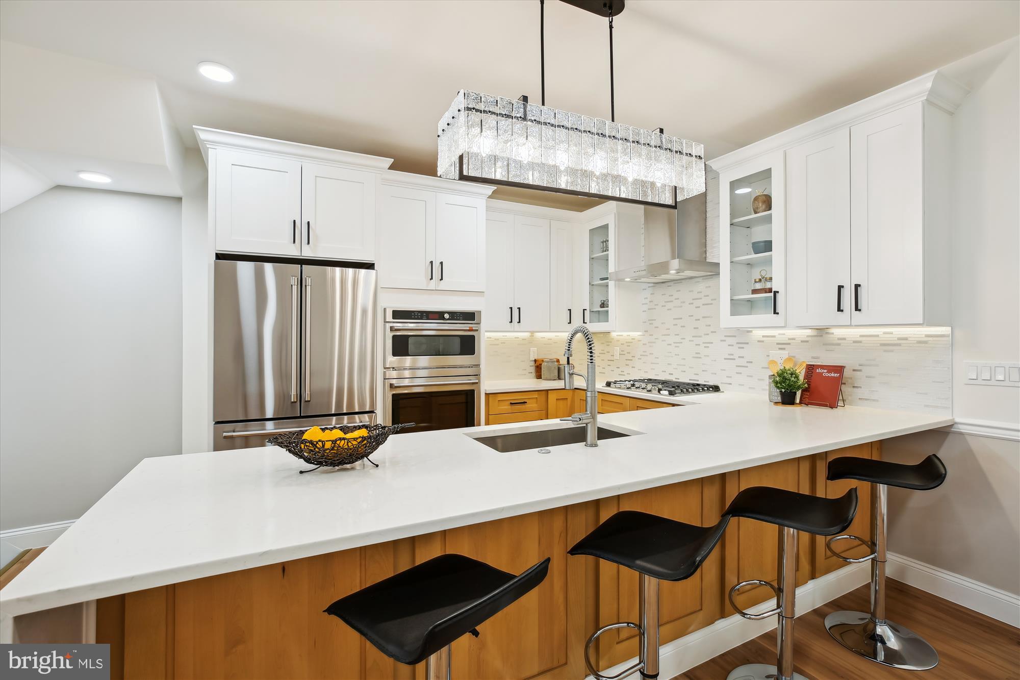 329 15th Street Northeast Washington, DC 20002 - Photo 10 of 71 a kitchen with a sink a stove and chairs