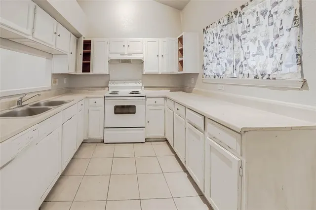 a kitchen with a cabinets and sink