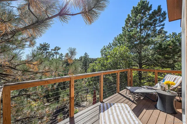 a view of balcony with wooden floor and outdoor seating