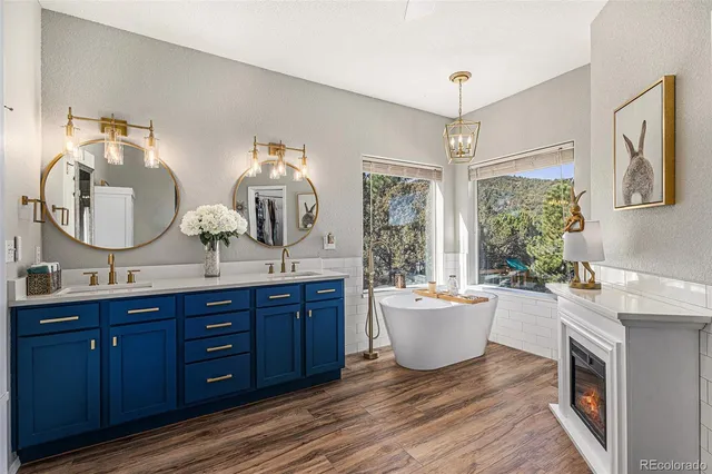 a living room with a couch and dresser with wooden floor