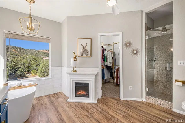 a view of livingroom with furniture fireplace and window