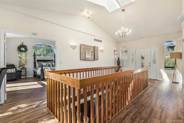 a view of a porch with wooden floor and windows