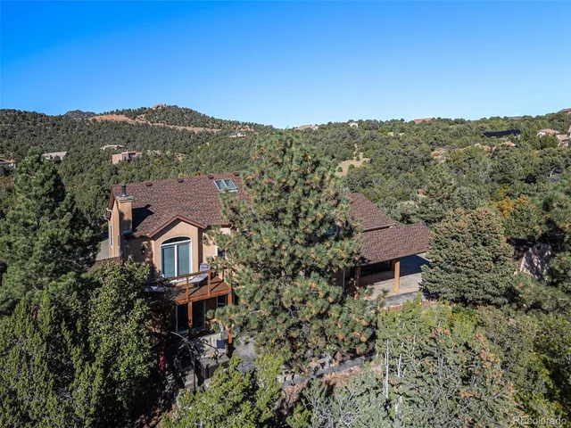 an aerial view of a house with a garden