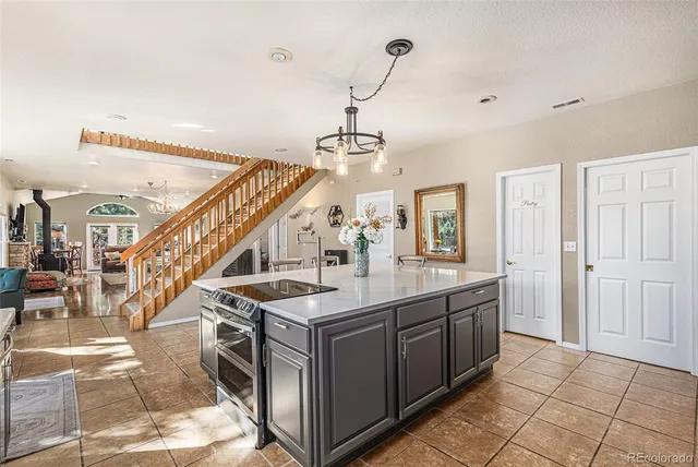 a view of a kitchen with sink and entryway
