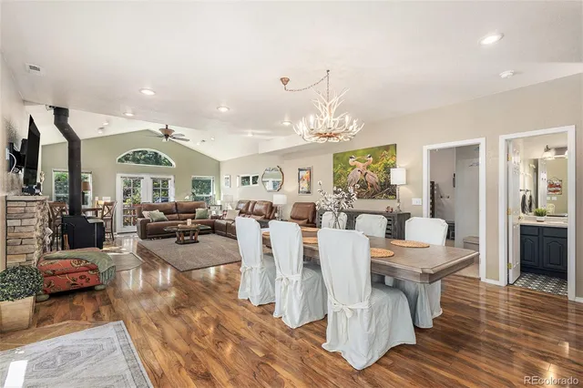 a living room with lots of furniture and a chandelier