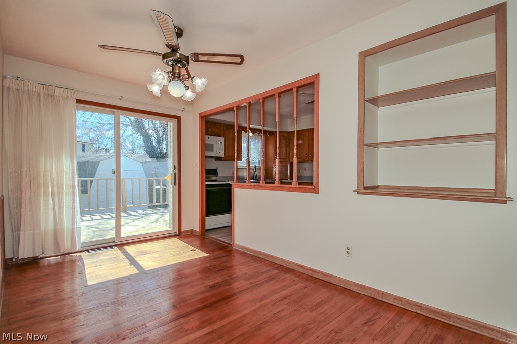 30224 Regent Road Wickliffe, OH 44092 - Photo 10 of 27 Spare room featuring hardwood / wood-style floors, ceiling fan, and built in shelves