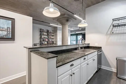 a kitchen with granite countertop a sink and a granite top