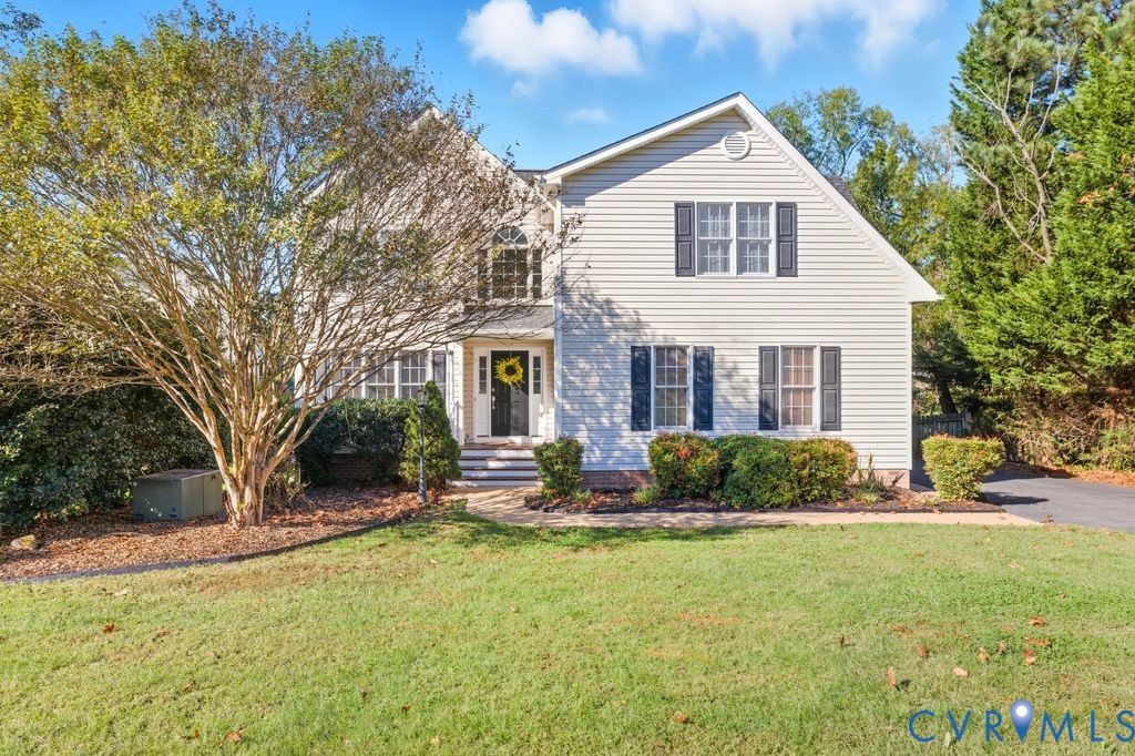 12004 Stamford Road Midlothian, VA 23112 - Photo 1 of 49 a front view of a house with a yard