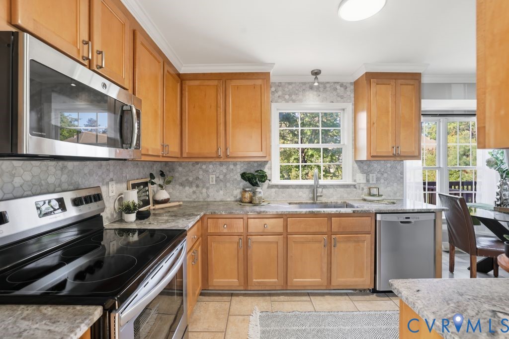 12004 Stamford Road Midlothian, VA 23112 - Photo 11 of 49 a kitchen with a sink stove top oven and cabinets