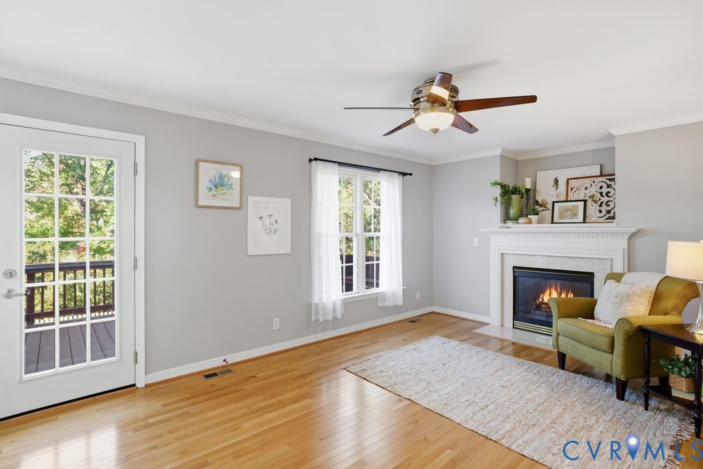 12004 Stamford Road Midlothian, VA 23112 - Photo 20 of 49 a living room with furniture and a fireplace