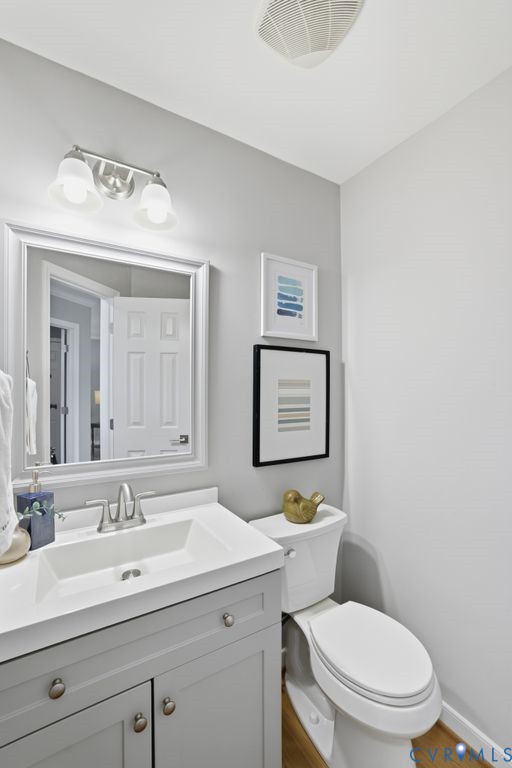 12004 Stamford Road Midlothian, VA 23112 - Photo 21 of 49 a bathroom with a toilet sink and mirror