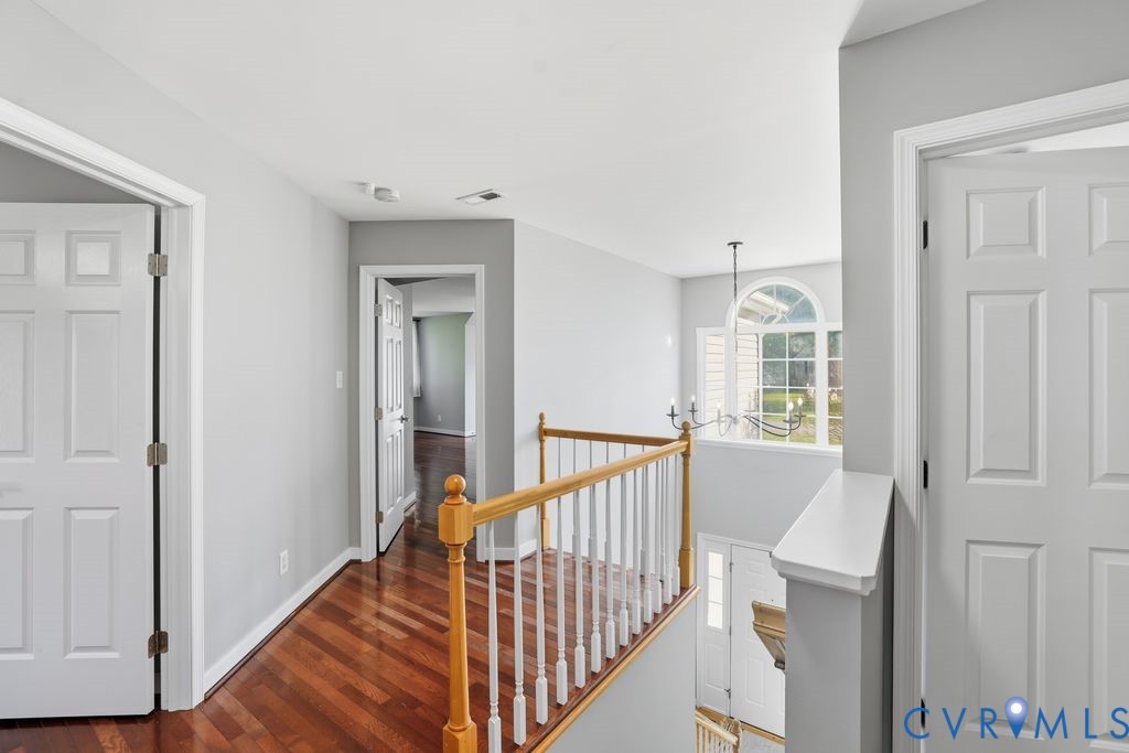 12004 Stamford Road Midlothian, VA 23112 - Photo 24 of 49 a view of a hallway with windows and stairs