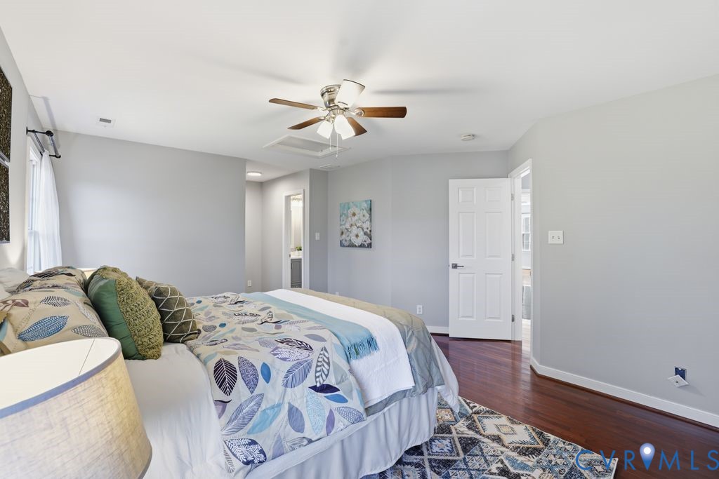 12004 Stamford Road Midlothian, VA 23112 - Photo 27 of 49 a bedroom with a bed and wooden floor