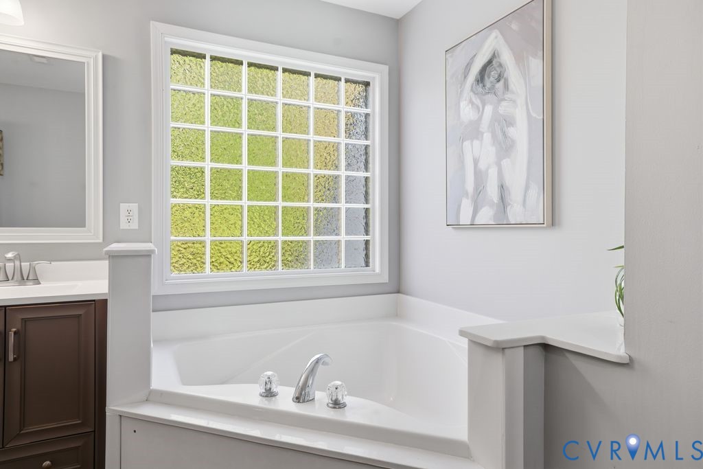 12004 Stamford Road Midlothian, VA 23112 - Photo 29 of 49 a white bath tub sitting next to a window