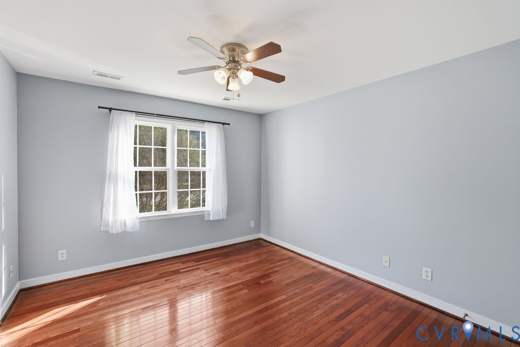 12004 Stamford Road Midlothian, VA 23112 - Photo 35 of 49 a view of empty room with wooden floor and fan
