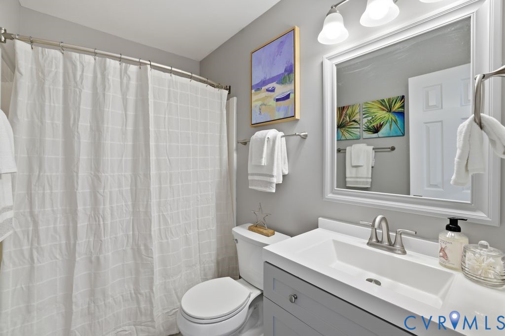 12004 Stamford Road Midlothian, VA 23112 - Photo 36 of 49 a bathroom with a sink vanity mirror and toilet
