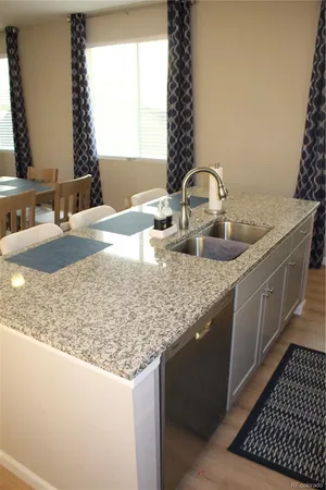 a bedroom with a bed and a lamp