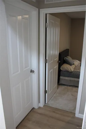 a bedroom with a bed and cabinets