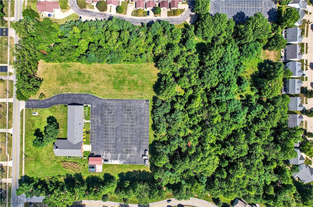 6689 Fry Road Middleburg Heights, OH 44130 - Photo 16 of 17 Aerial view of property's location with a tree filled landscape