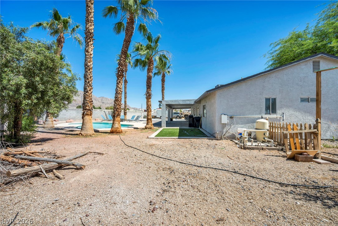 5882 Rio Tinto Way Las Vegas, NV 89110 - Photo 51 of 56 A desert oasis awaits, complete with a private pool and a spacious, covered patio.
