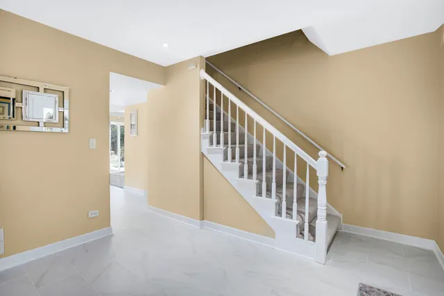 a view of a hallway with staircase