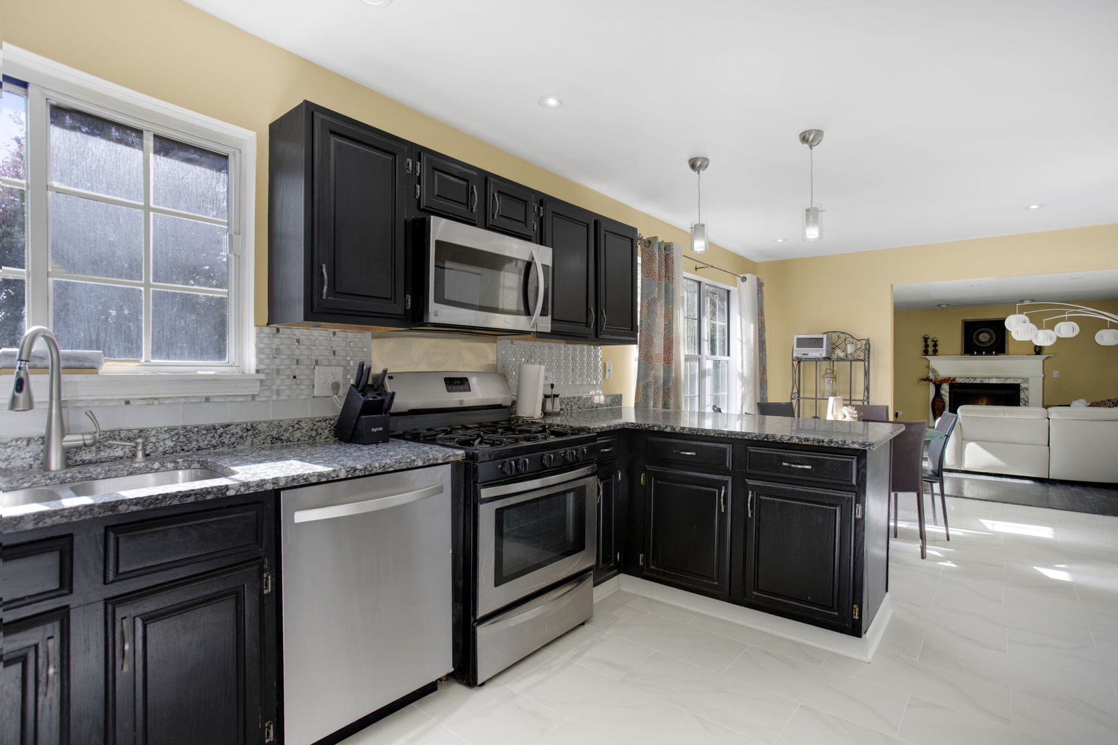 754 Huntington Drive Carol Stream, IL 60188 - Photo 7 of 29 a kitchen with a sink stove and microwave