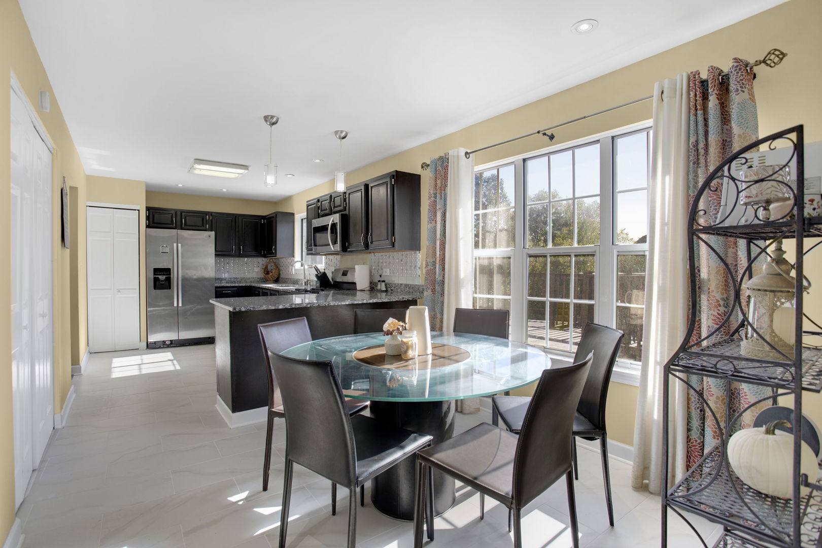 754 Huntington Drive Carol Stream, IL 60188 - Photo 8 of 29 a view of a dining room with furniture window and wooden floor