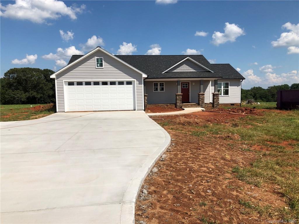 1311 George Brown Road Crouse, NC 28033 - Photo 2 of 32 a front view of a house with a yard and garage
