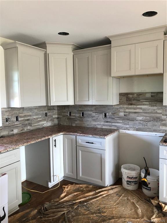 1311 George Brown Road Crouse, NC 28033 - Photo 11 of 32 a kitchen with stainless steel appliances granite countertop a sink stove and cabinets